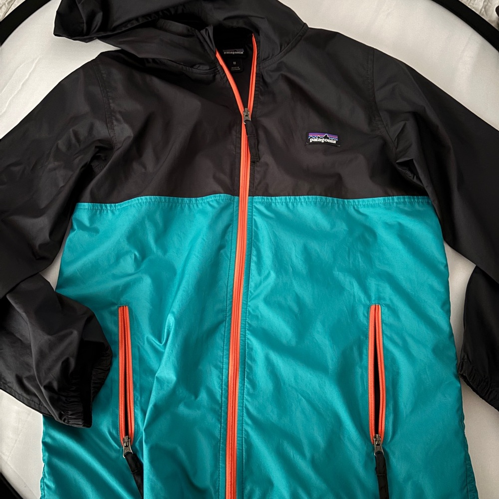 Patagonia Kids' Black and Teal Raincoat with Orange Accents